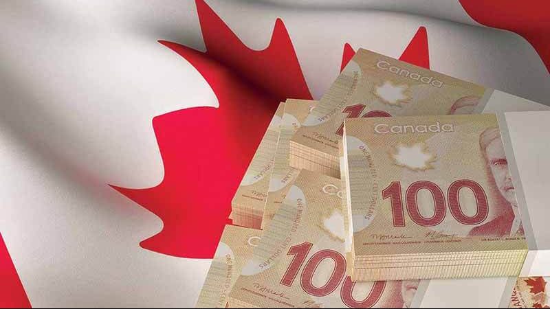 Dólares e a bandeira canadense